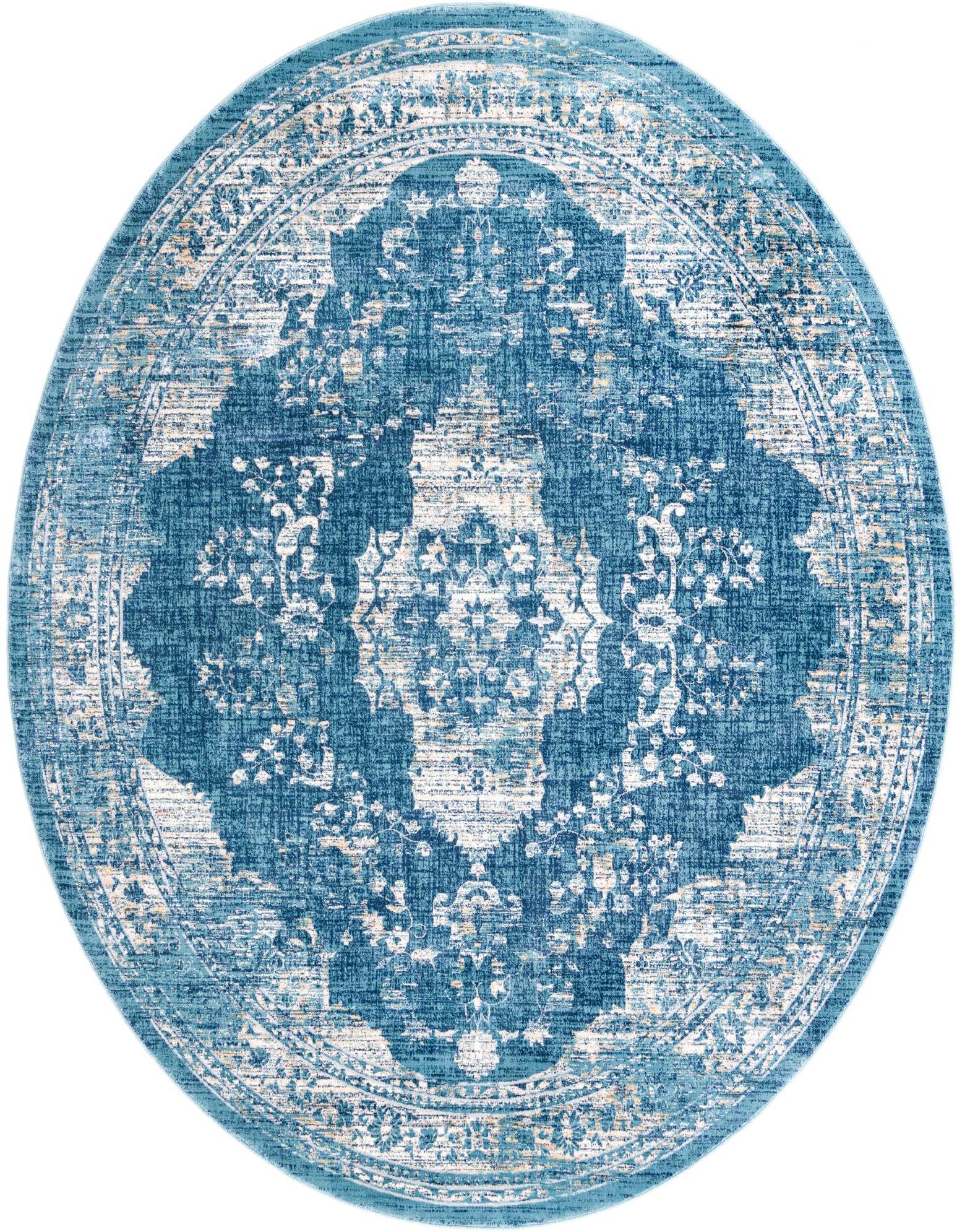 A 10-foot round Dahlia rug in various shades of blue with a distressed traditional medallion pattern.