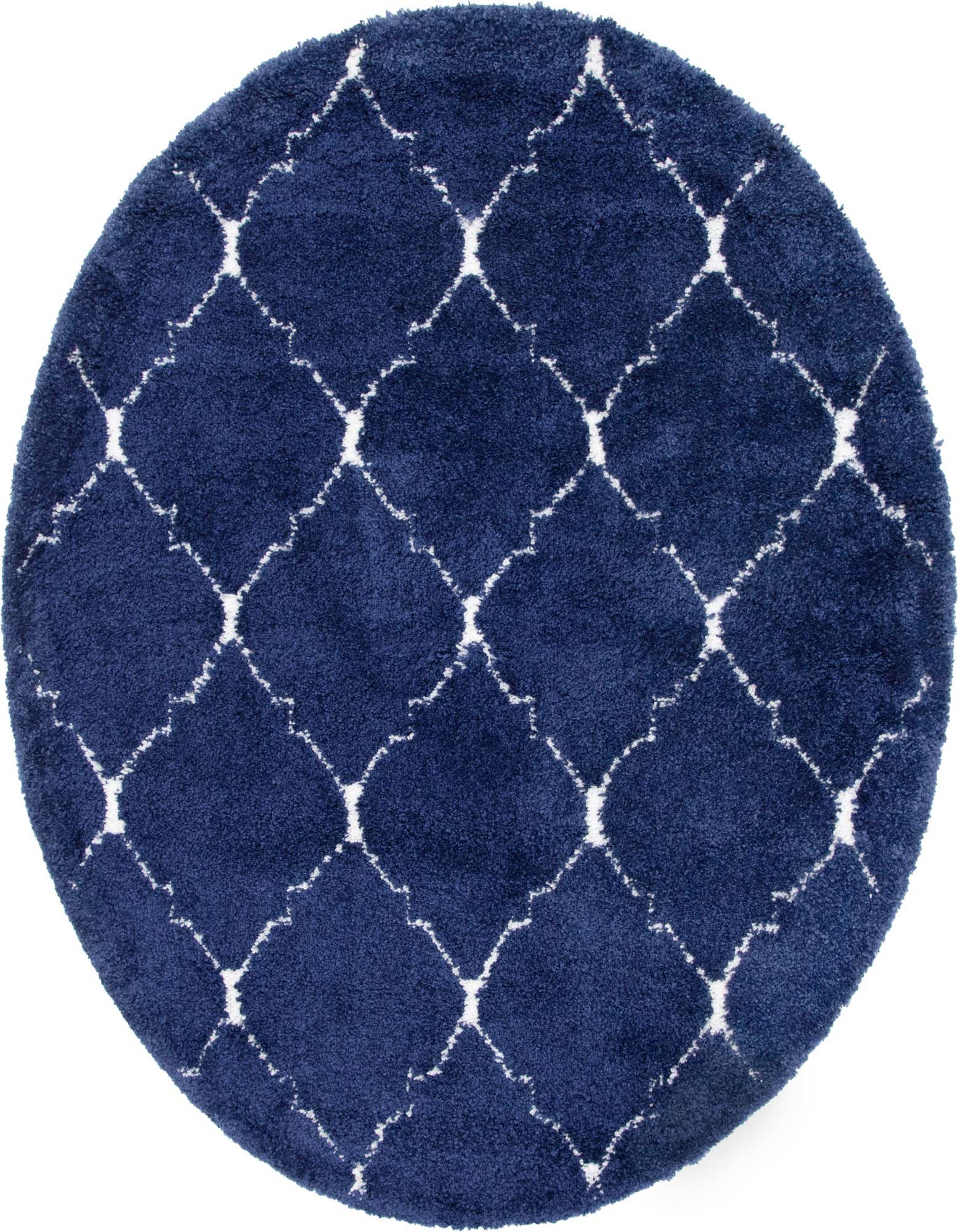 A round navy blue shag rug with a white Moroccan trellis pattern, offering a soft, textured feel.