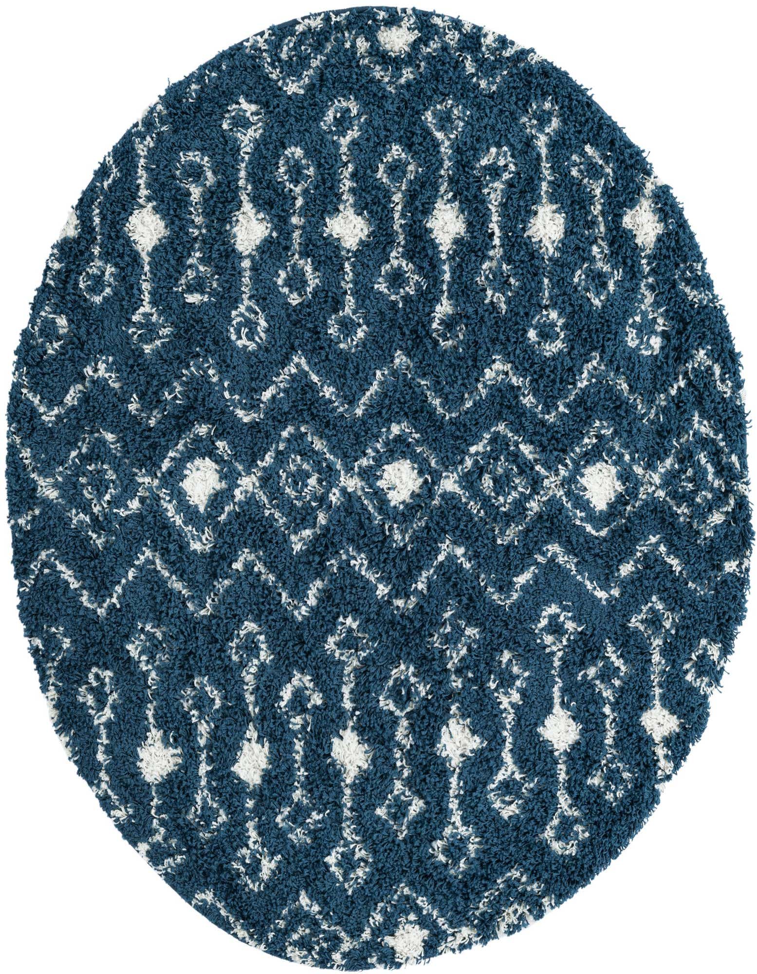 A 5' 3 round navy blue shag rug with a white tribal geometric pattern, featuring diamonds and zigzags.