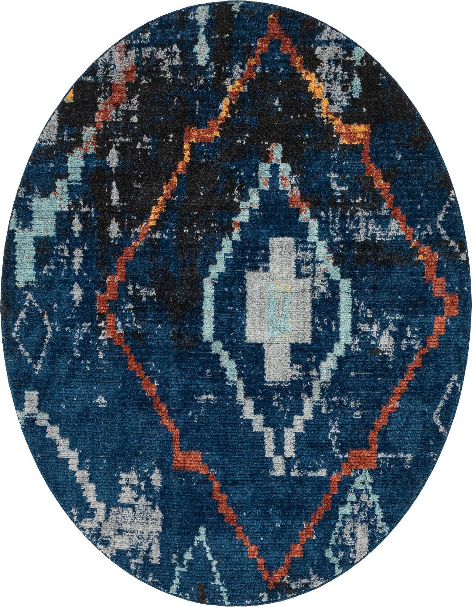A 7' round navy blue shag rug featuring a distressed bohemian tribal pattern with orange, light blue, and gray accents.