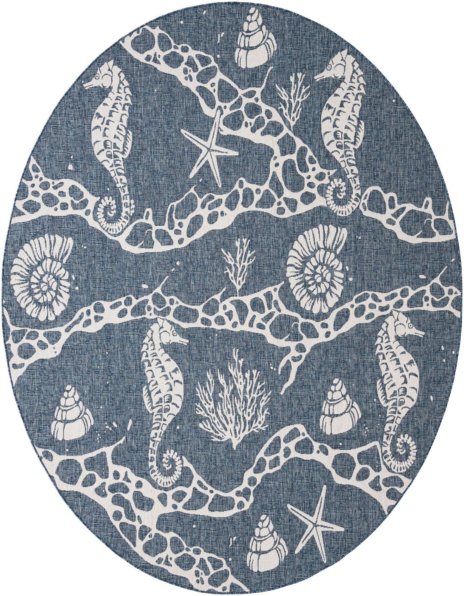 A round navy blue and white coastal rug featuring seahorses, starfish, and seashells, perfect for a patio.