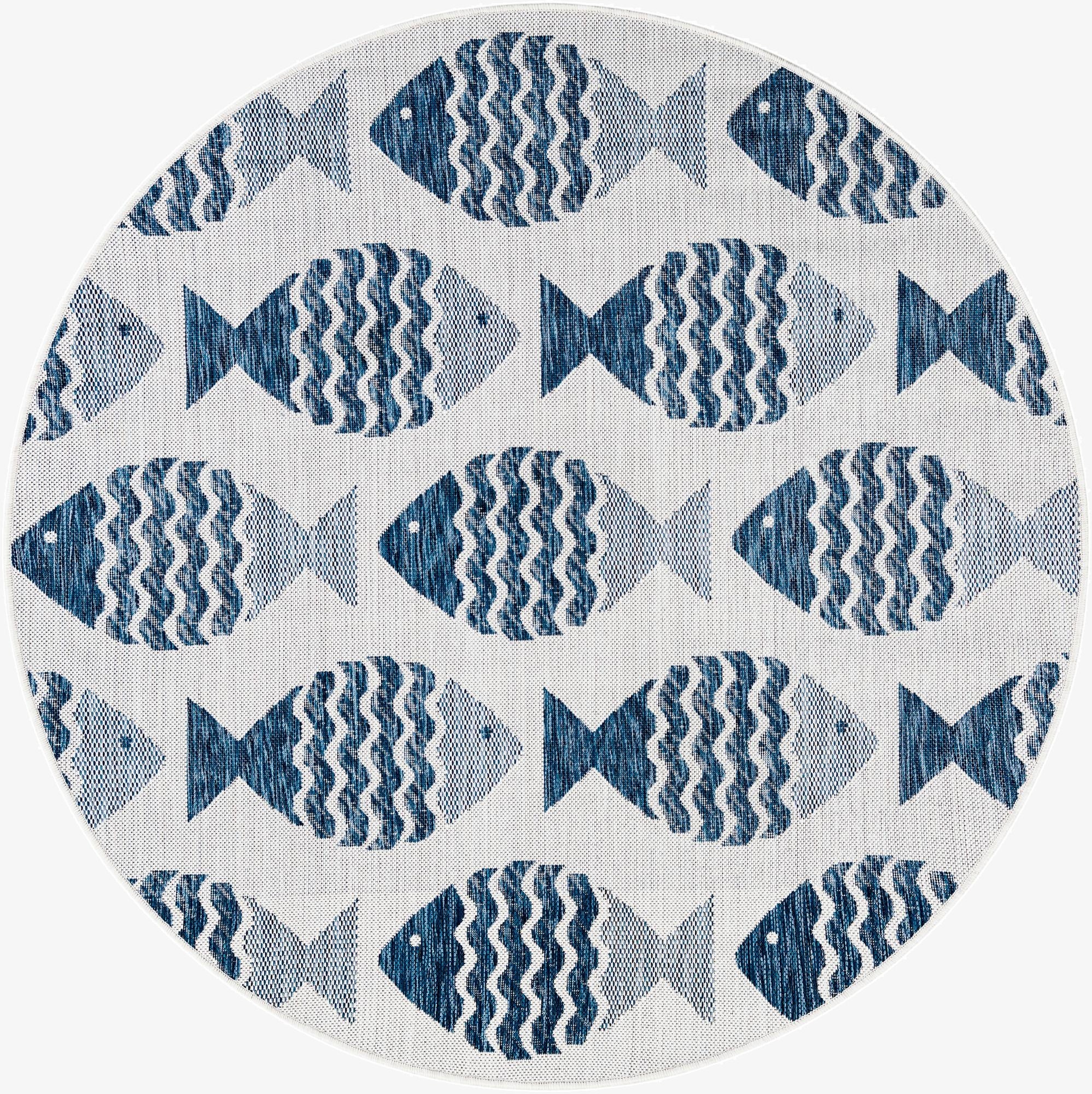 A round 5' 3 x 5' 3 indoor/outdoor rug with a modern coastal pattern of navy blue fish on a light background.