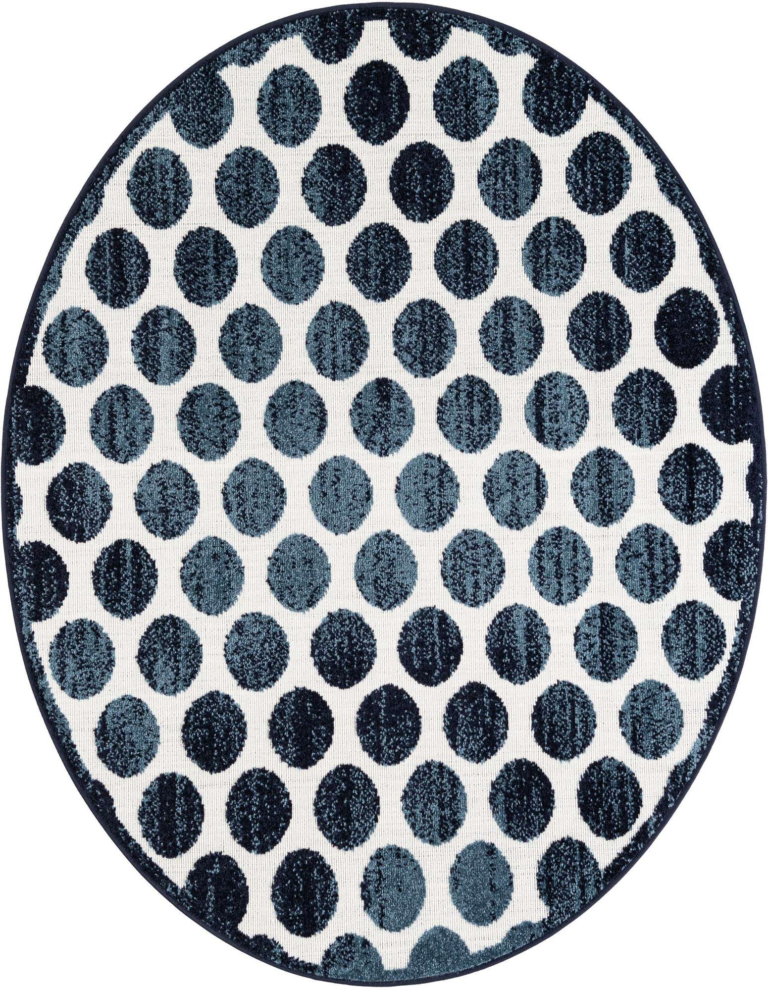 A 5' round indoor/outdoor rug with a modern navy blue and white polka dot pattern, perfect for a patio.