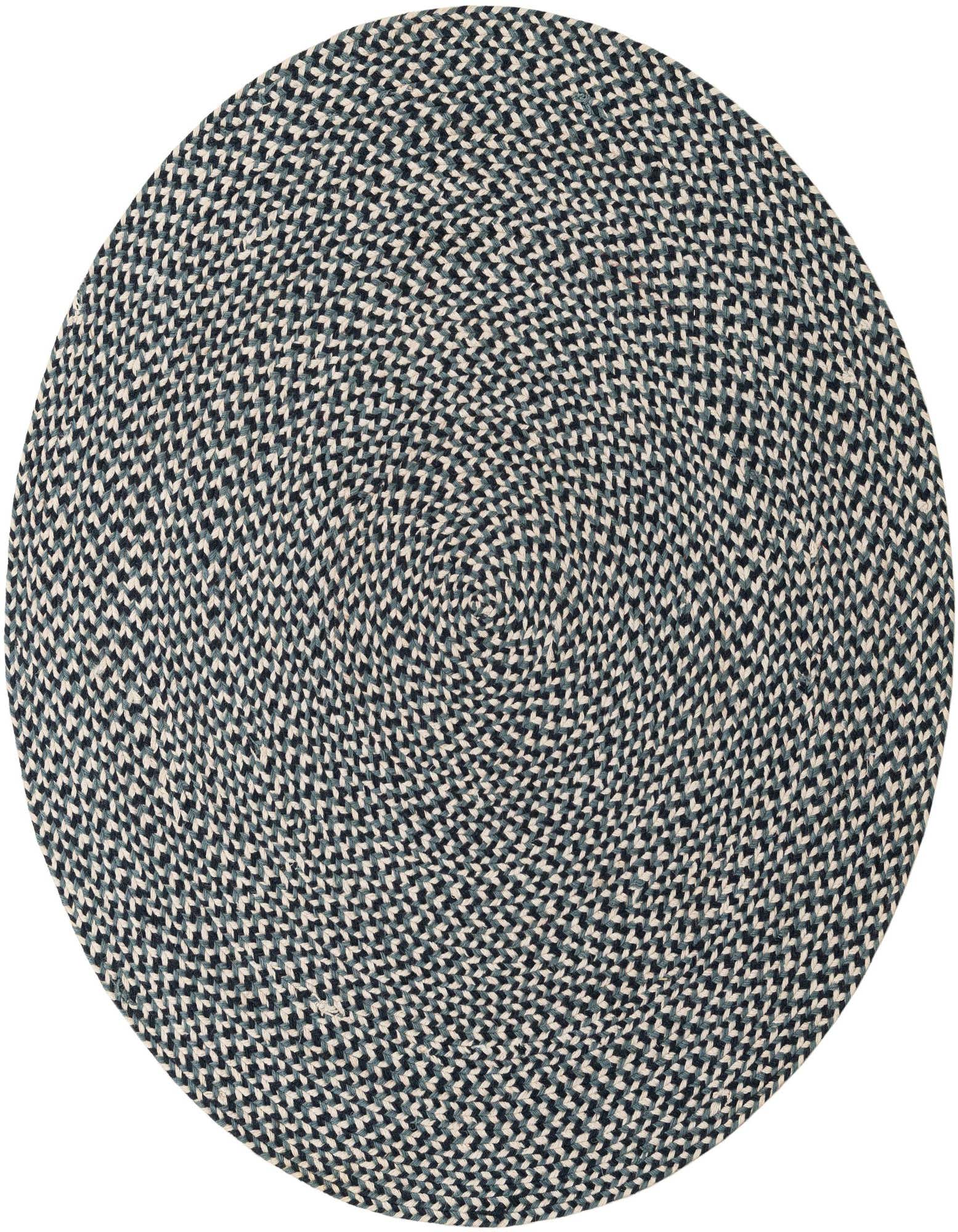A 4' 1 round braided jute rug in shades of navy blue and off-white, featuring a modern woven pattern.