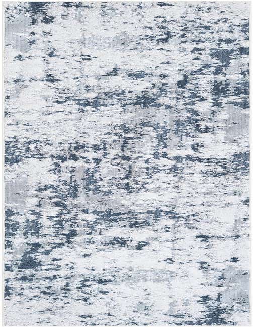 A 10 ft runner rug from the Rugs.com Abbey collection, featuring an abstract pattern in varying shades of blue and white, with a textured, high-pile surface.