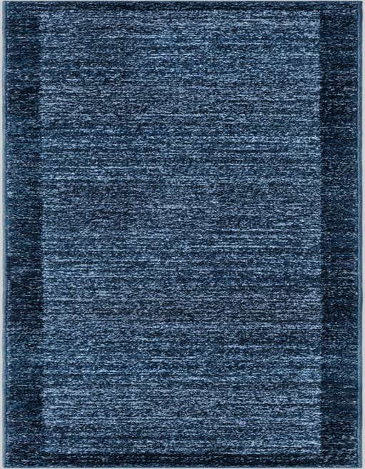 A long, rectangular 8 ft runner rug in varying shades of deep navy blue, featuring a subtle textured pattern and a darker border.