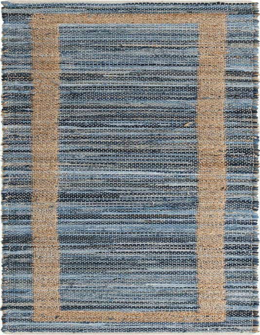 A 10 ft runner rug featuring a textured flatweave of various blue denim strips and a natural jute border.