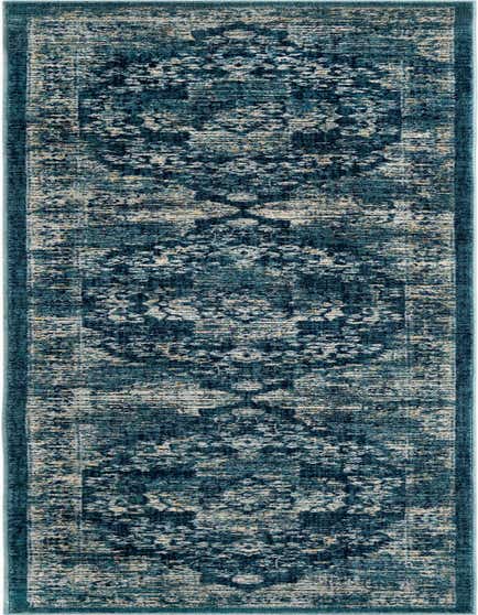 A 12 ft runner rug from the Dahlia collection, featuring a distressed navy blue and cream medallion pattern, perfect for a hallway.