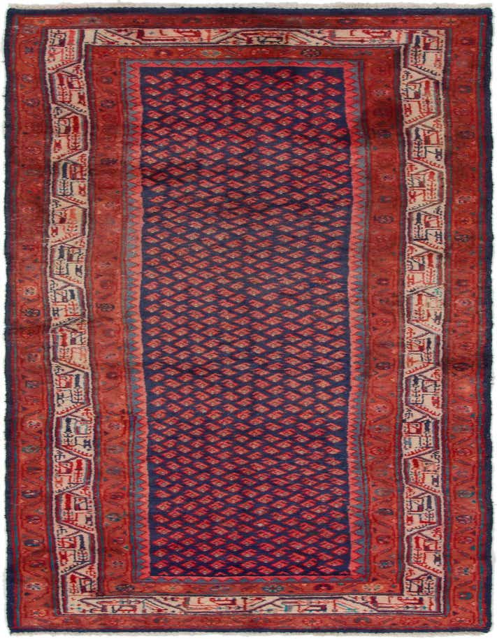 A 10 ft Farahan runner rug featuring a navy blue field with red diamond patterns and a detailed red and cream border.