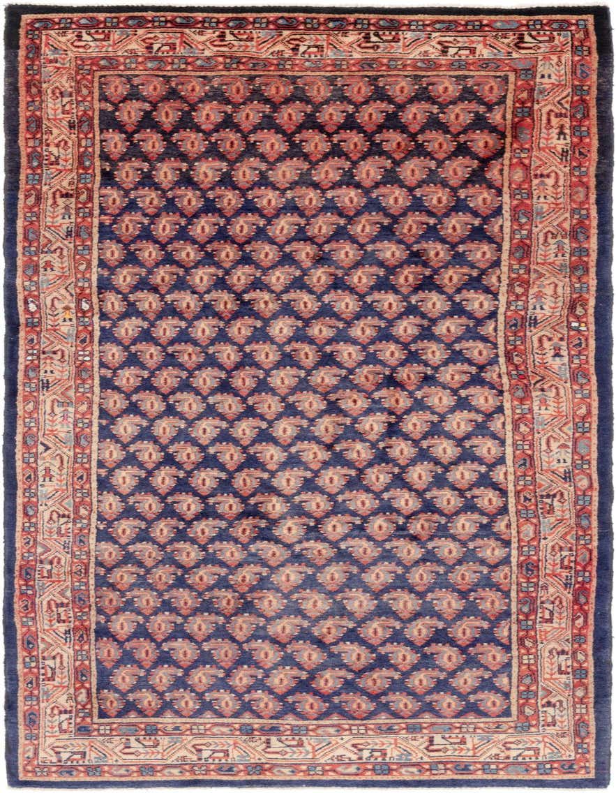 A handmade 11 ft wool runner rug featuring a traditional tribal pattern in navy blue, red, and beige.