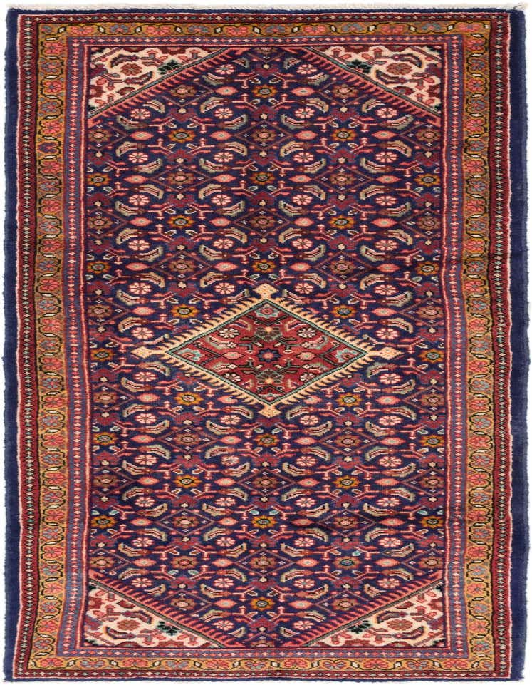 A 10 ft runner rug in navy blue with a traditional Persian medallion pattern and intricate floral motifs.