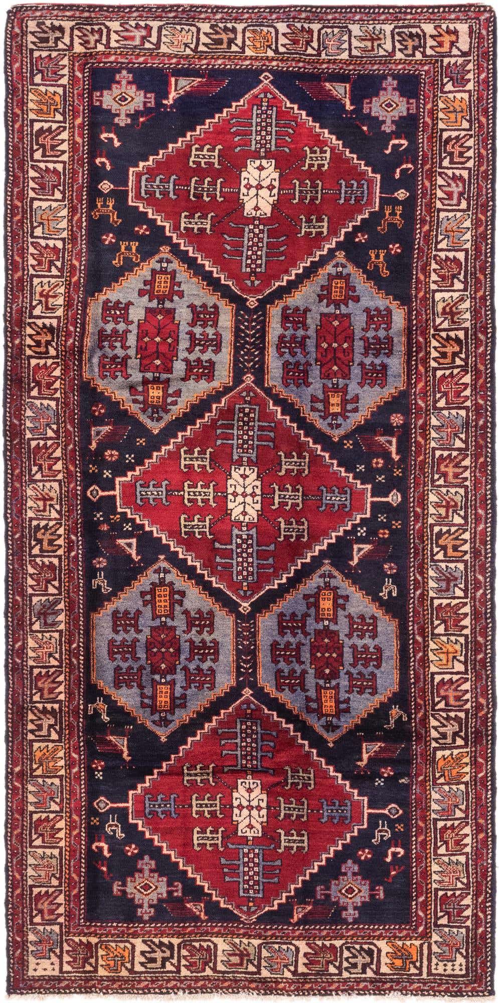A 9 ft Hamedan runner rug featuring traditional Persian patterns in deep blues, reds, and subtle accents, ideal for a hallway.