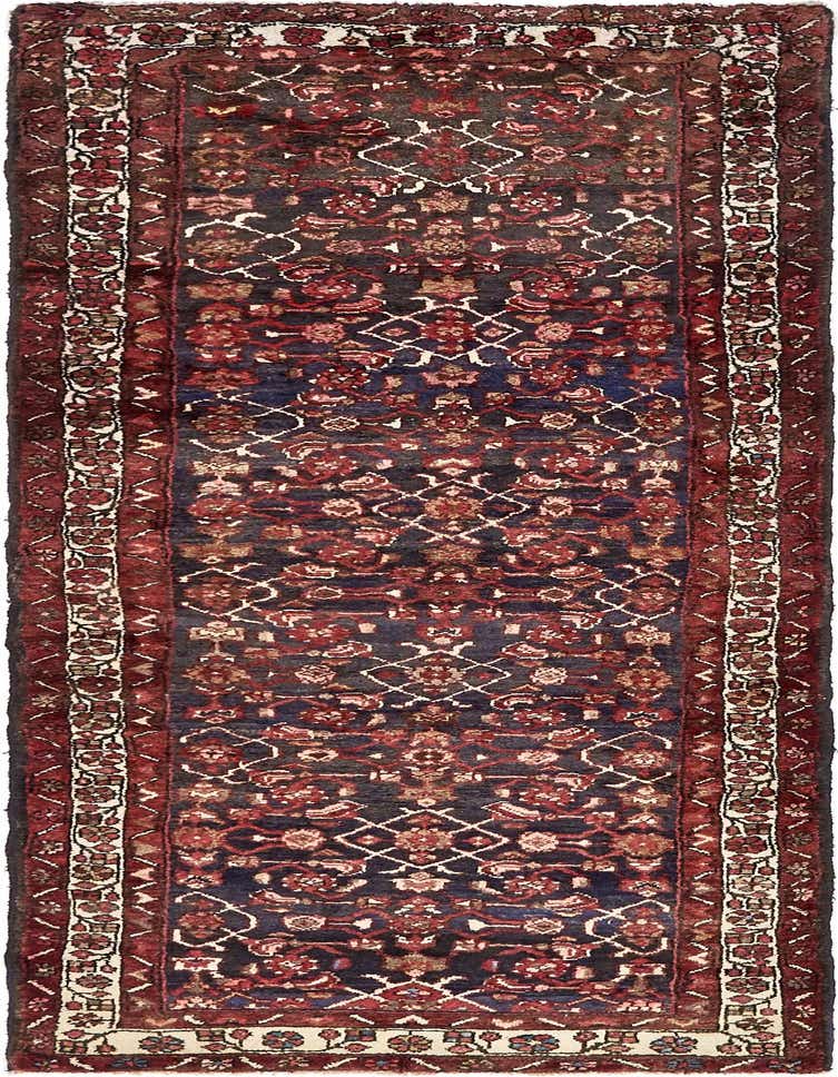 A 10 ft Hossainabad runner rug featuring a deep navy blue field with red, cream, and brown tribal Persian patterns, ideal for hallways.