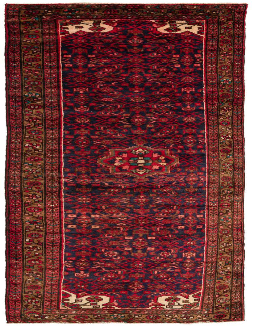 A 10 ft runner rug from the Hossainabad collection, featuring a traditional Persian medallion pattern in deep blues and reds with tribal accents, perfect for a hallway.