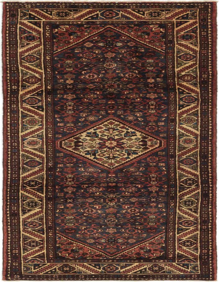 A handmade 11 ft runner rug featuring a traditional Persian medallion pattern in blues, reds, and creams, ideal for a hallway.
