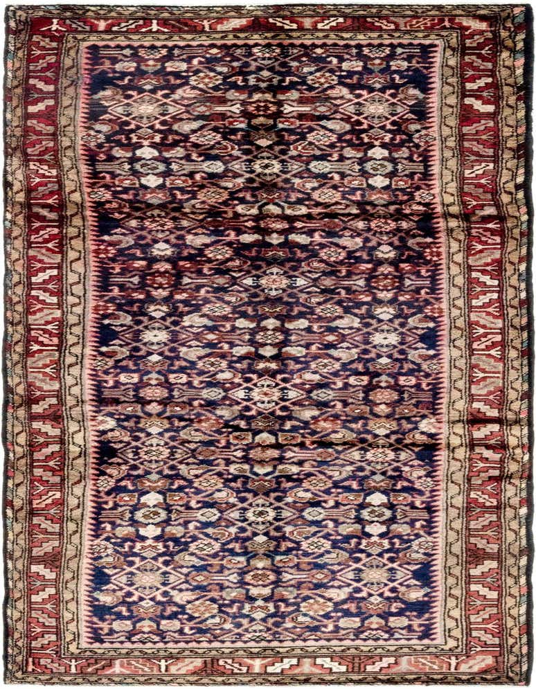 A 10 ft runner rug with a navy blue field and intricate traditional Persian patterns in red, beige, and brown.