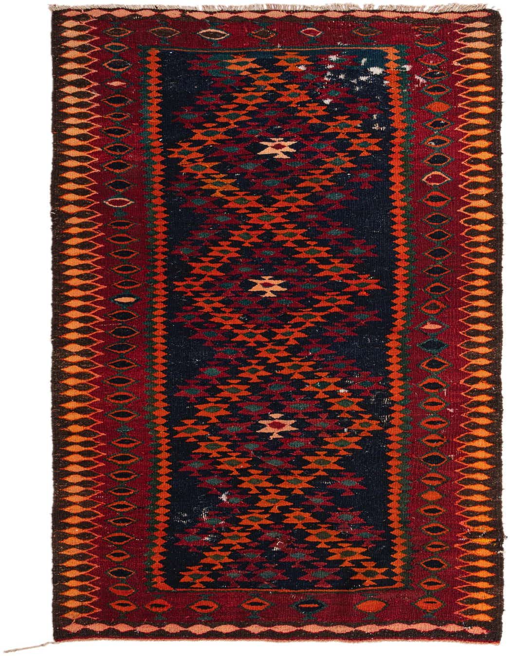 A 9 ft Kilim Fars runner rug with a navy blue center and tribal patterns in orange, red, and green, framed by a deep red border with geometric motifs.