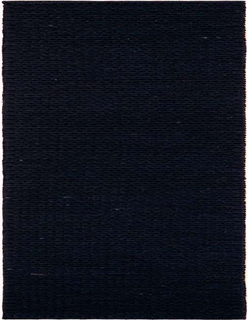 A close-up view of a dark navy blue Lana New Zealand Wool runner rug, showcasing its textured, solid modern design.