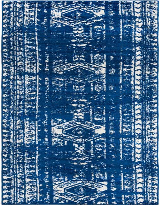 A 14 ft runner rug in a distressed navy blue and white Southwestern tribal pattern, perfect for a hallway.