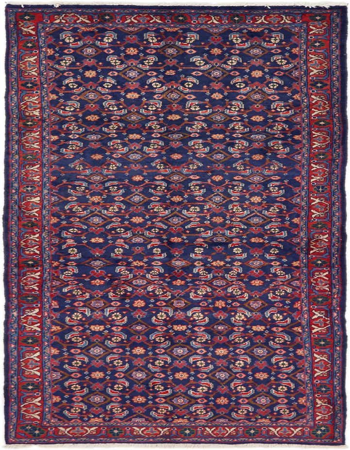 A 10 ft runner rug with a navy blue field and intricate red, blue, and cream traditional Persian patterns, ideal for a hallway.