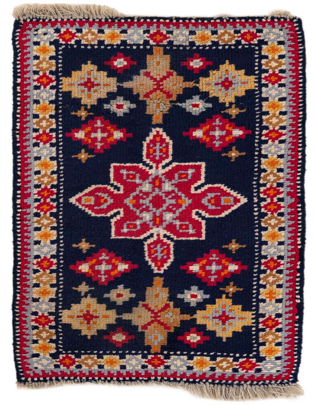 A 4 Ft runner rug with a navy blue background and a vibrant red medallion pattern, flanked by tribal motifs in orange, gold, and light blue, with fringed ends.