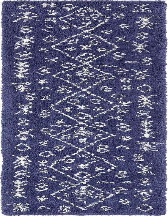 A long, plush 10 ft runner rug in deep navy blue with a white abstract tribal pattern, perfect for a hallway.