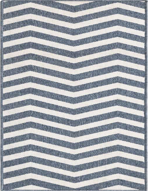A navy blue and white chevron stripe runner rug with a textured flatweave, ideal for a hallway or patio.
