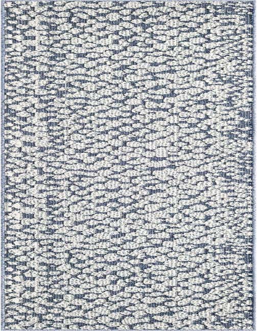 A navy blue and white modern abstract runner rug with a textured, dotted pattern, suitable for a hallway or patio.