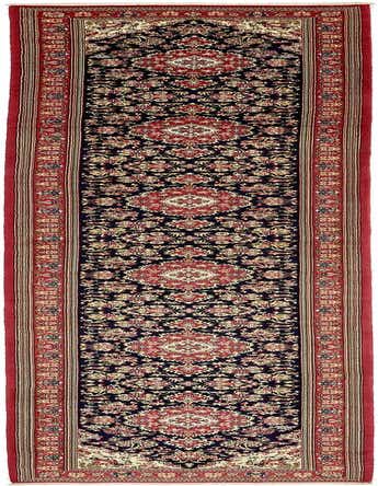 A long 16 ft runner rug with a navy blue field and intricate red, cream, and gold Persian floral patterns, ideal for a hallway.