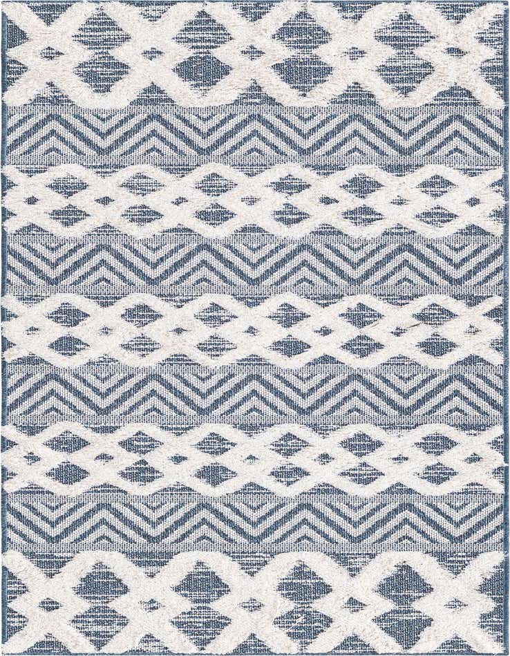 A 6 ft runner rug with a tribal and modern pattern in varying shades of blue and off-white, featuring textured diamond and chevron designs.