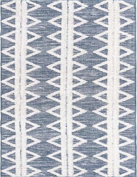 A 12 ft runner rug with a modern tribal pattern in navy blue and white, featuring textured high pile stripes and geometric shapes.
