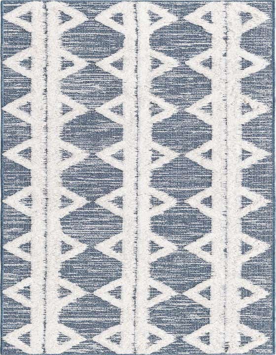 A navy blue and white tribal pattern runner rug with textured high pile diamonds and stripes, ideal for a hallway.