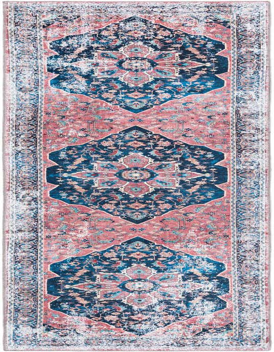 A 10 ft runner rug with a distressed vintage medallion pattern in shades of navy blue, coral, and light blue.