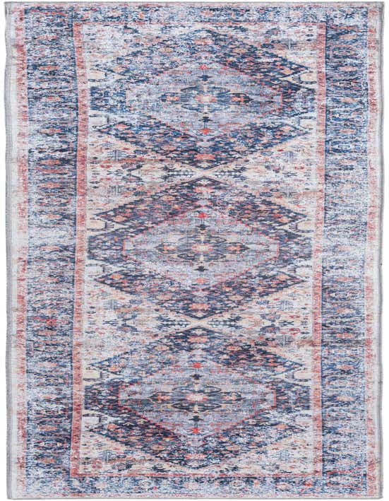 A 10 ft runner rug featuring a distressed tribal medallion pattern in shades of navy blue, light blue, and hints of rust.