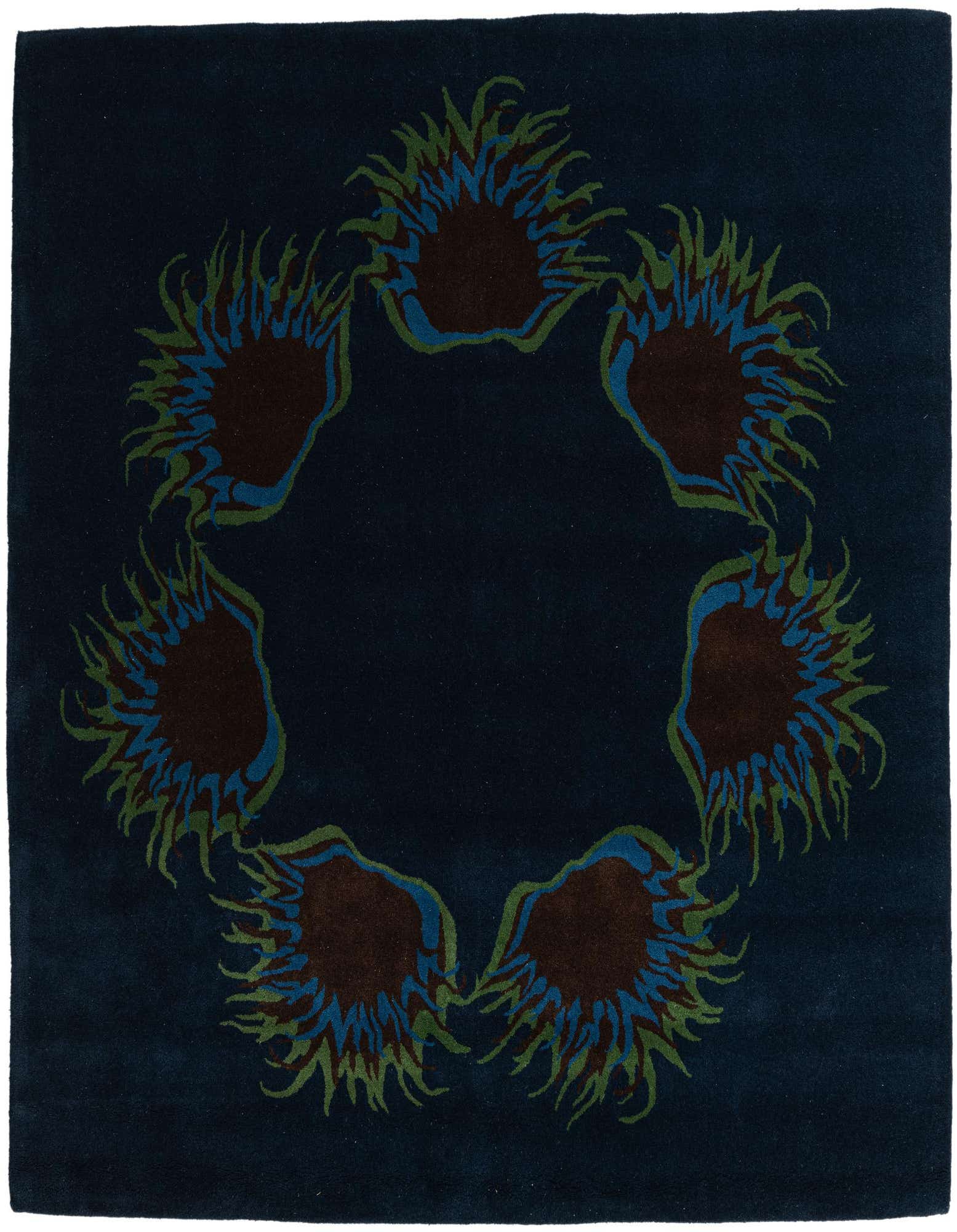 A square navy blue wool rug with a central circular floral pattern in brown, teal, and olive green.