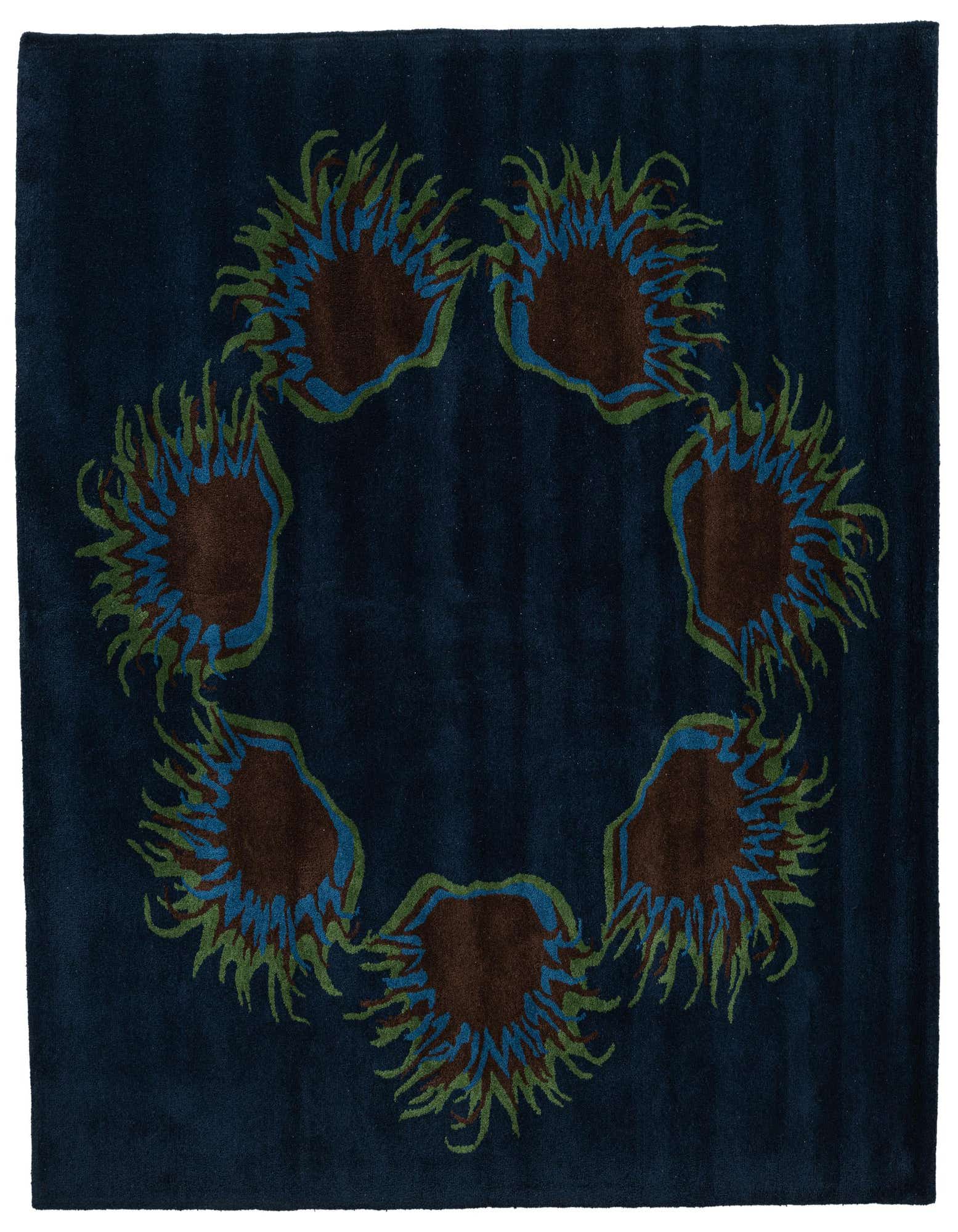 A square navy blue rug featuring a circular pattern of abstract brown, blue, and green floral or sunburst shapes.