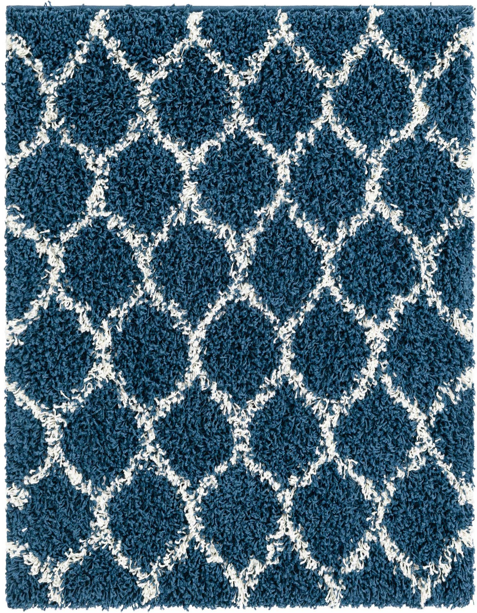 A square navy blue shag rug with a white modern lattice pattern, featuring a textured high-low pile.