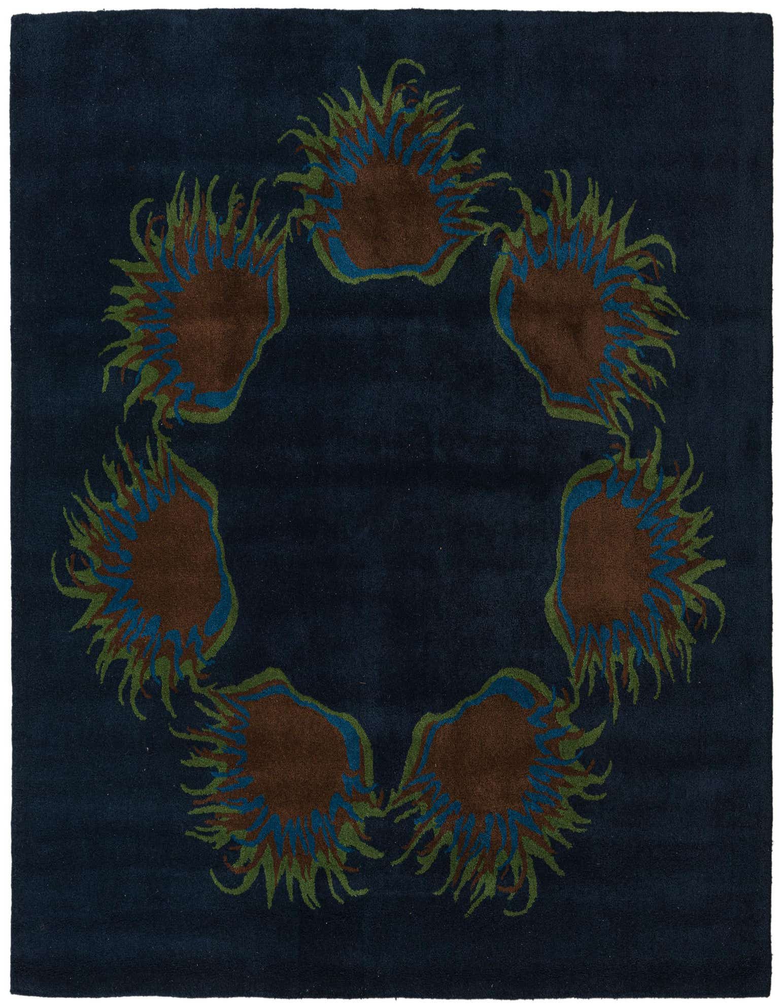 A square navy blue rug with a modern circular pattern of abstract brown, blue, and green shapes.