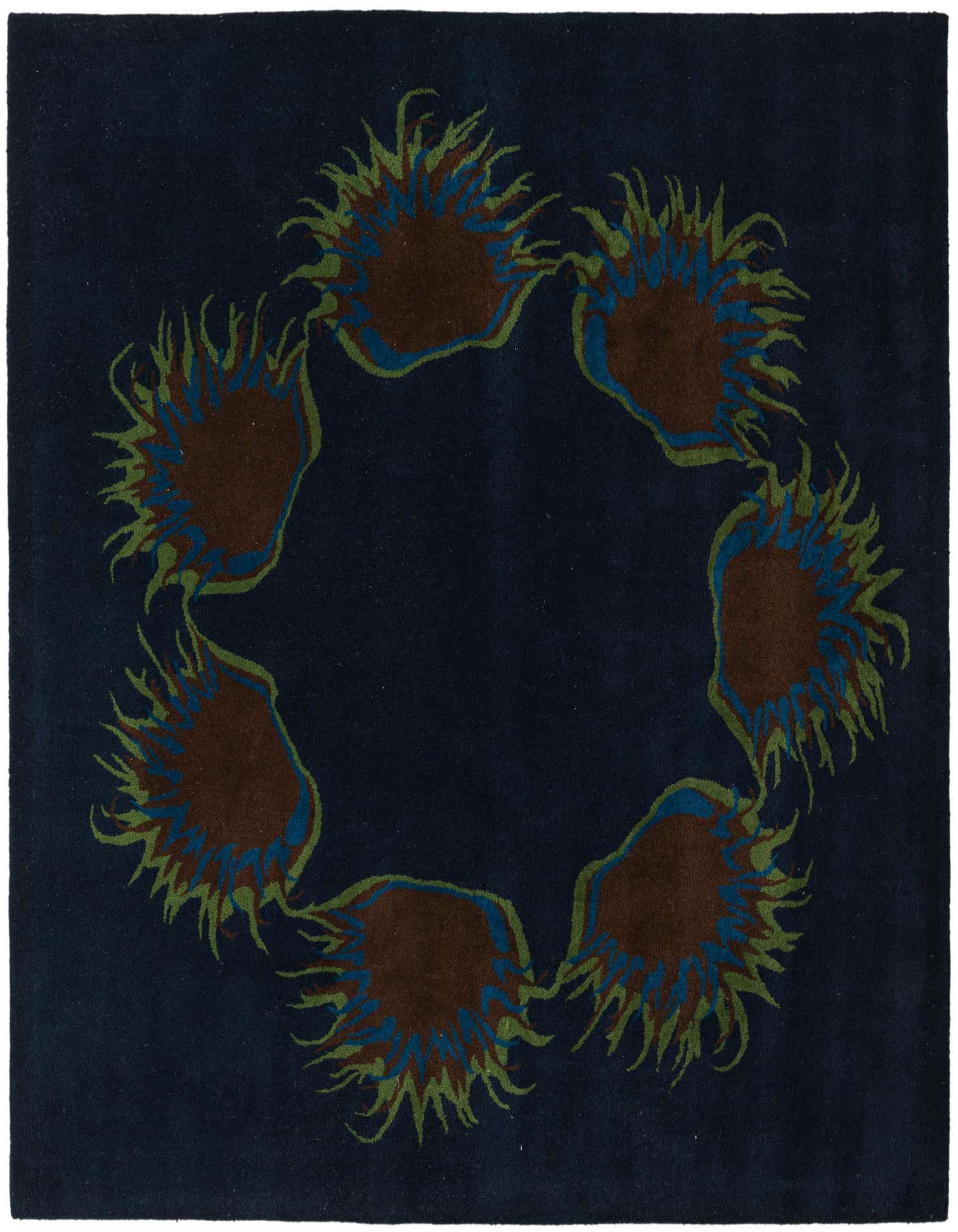 A square navy blue modern wool rug with a circular pattern of abstract brown, blue, and green shapes.