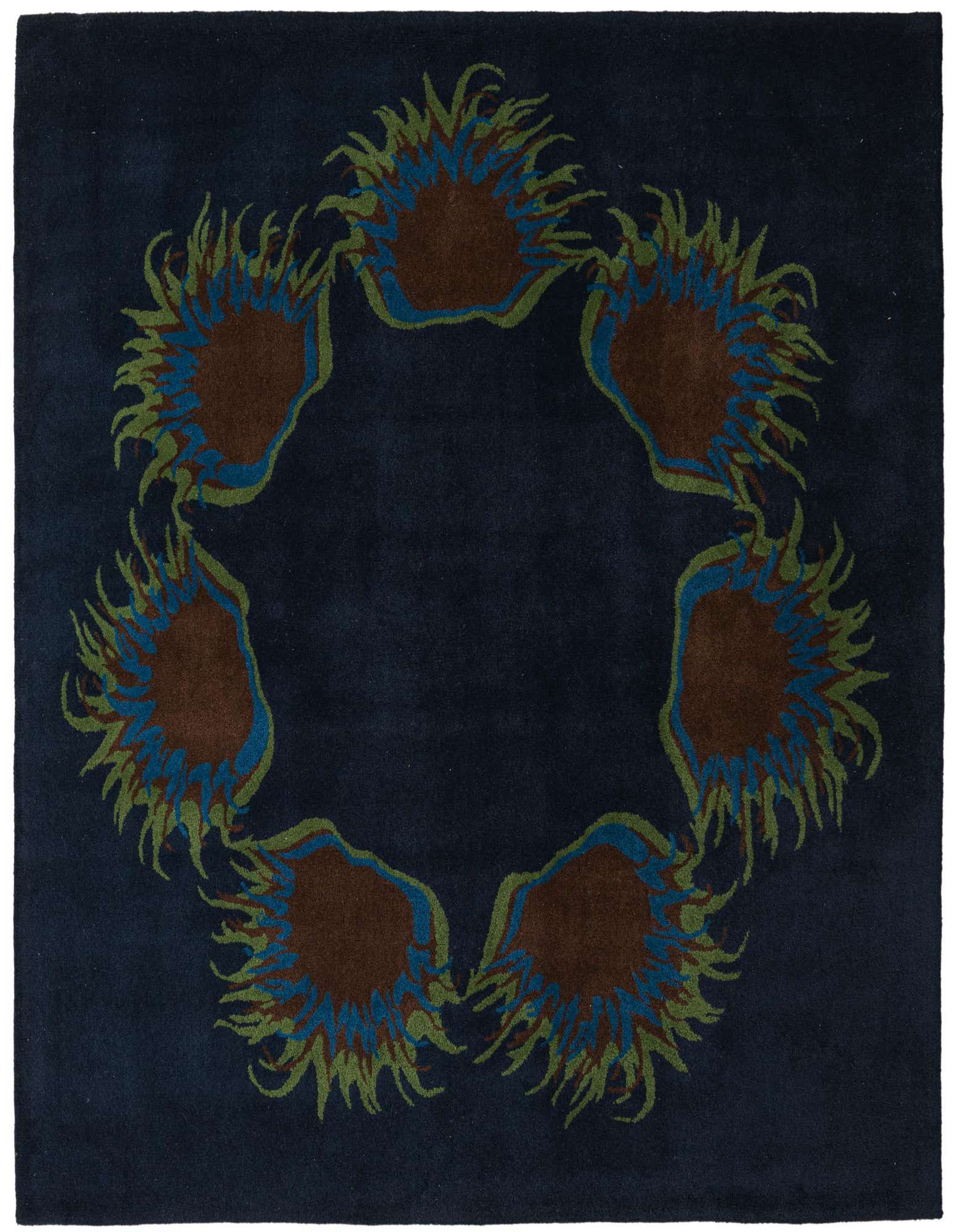 A square navy blue wool rug featuring a circular modern floral design with brown, blue, and green accents.