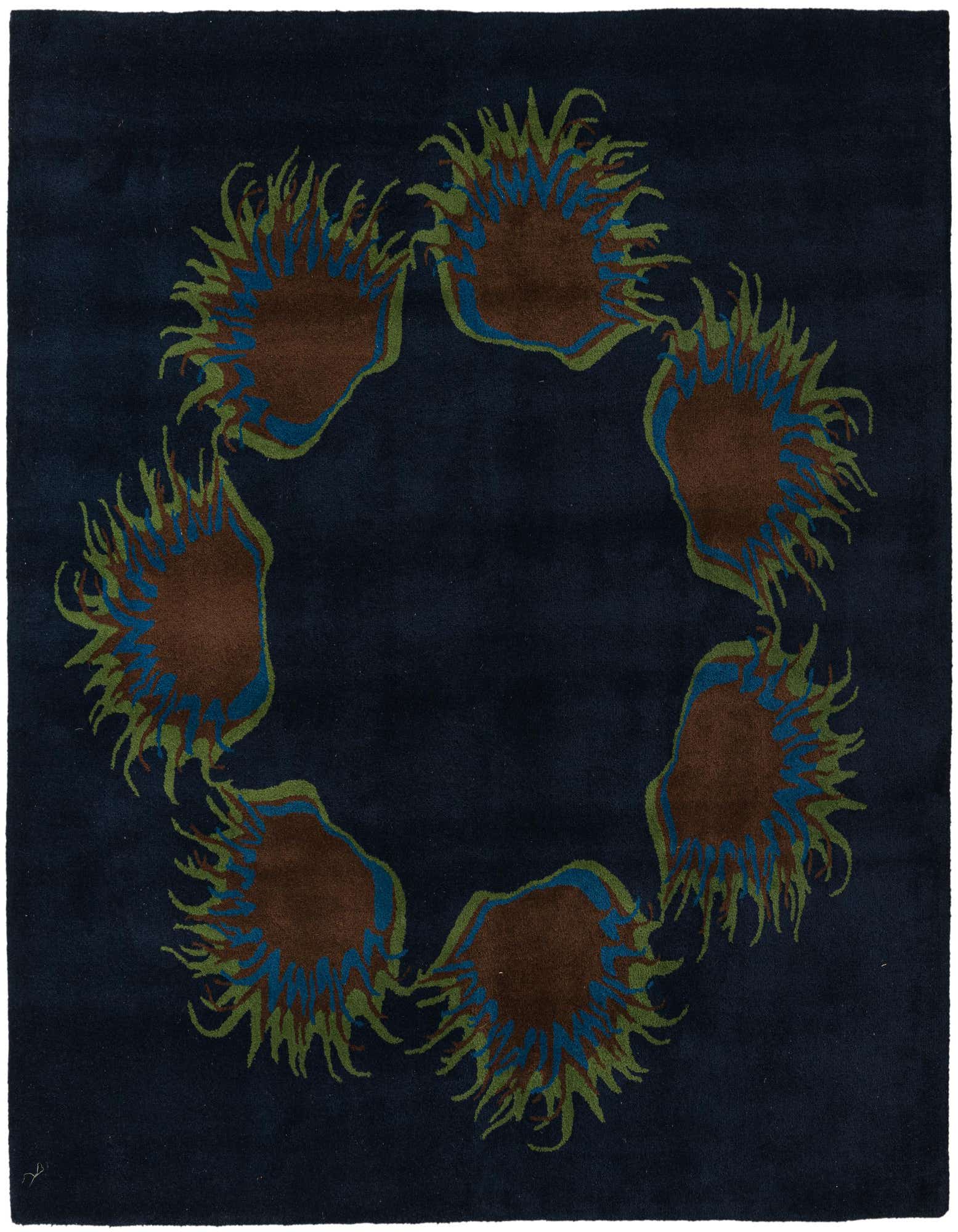 A square navy blue wool rug featuring a circular modern floral pattern with brown, blue, and green accents.