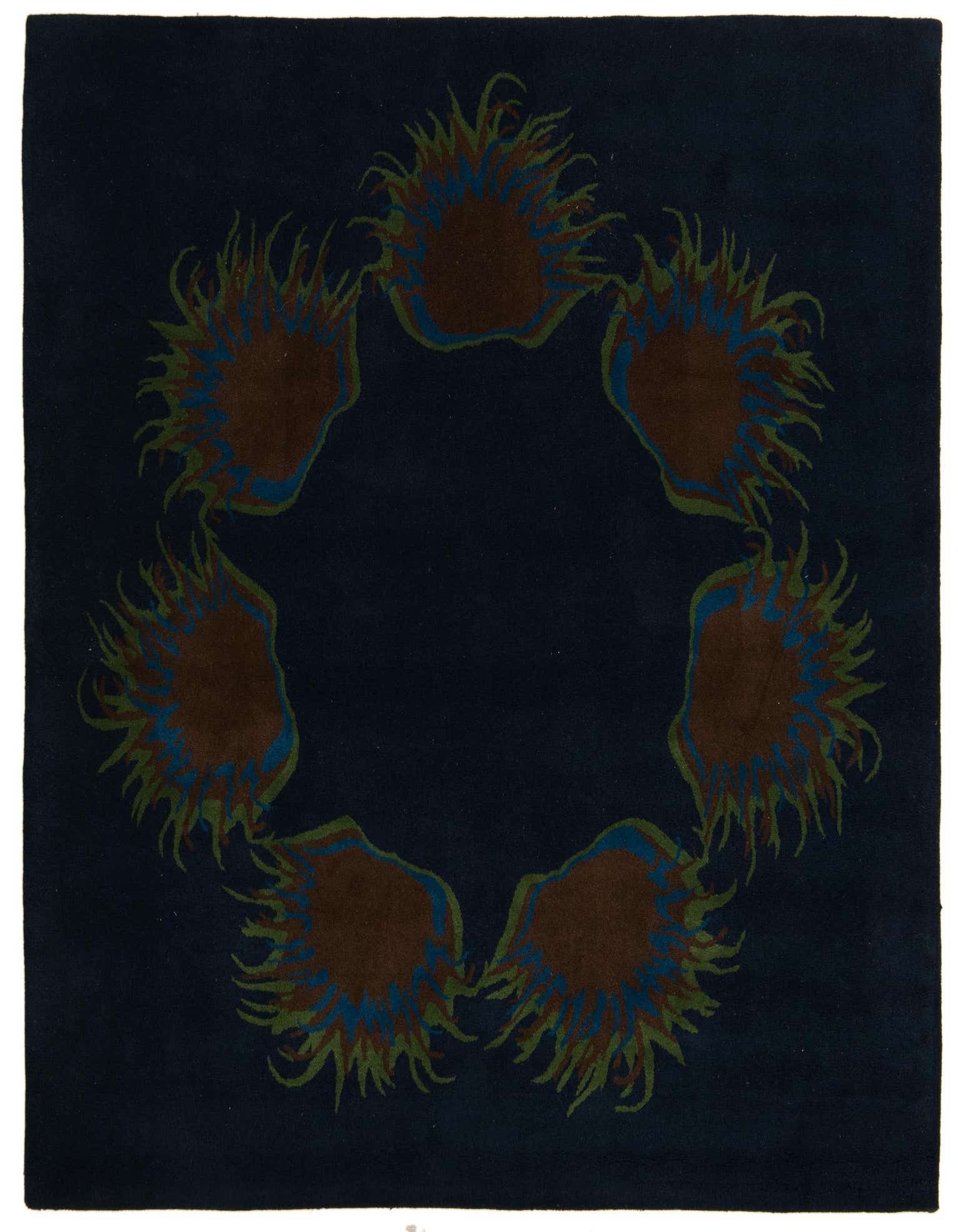 A 7' 7 x 7' 7 square navy blue rug with a modern floral pattern of brown, blue, and green sunburst shapes arranged in a circle.