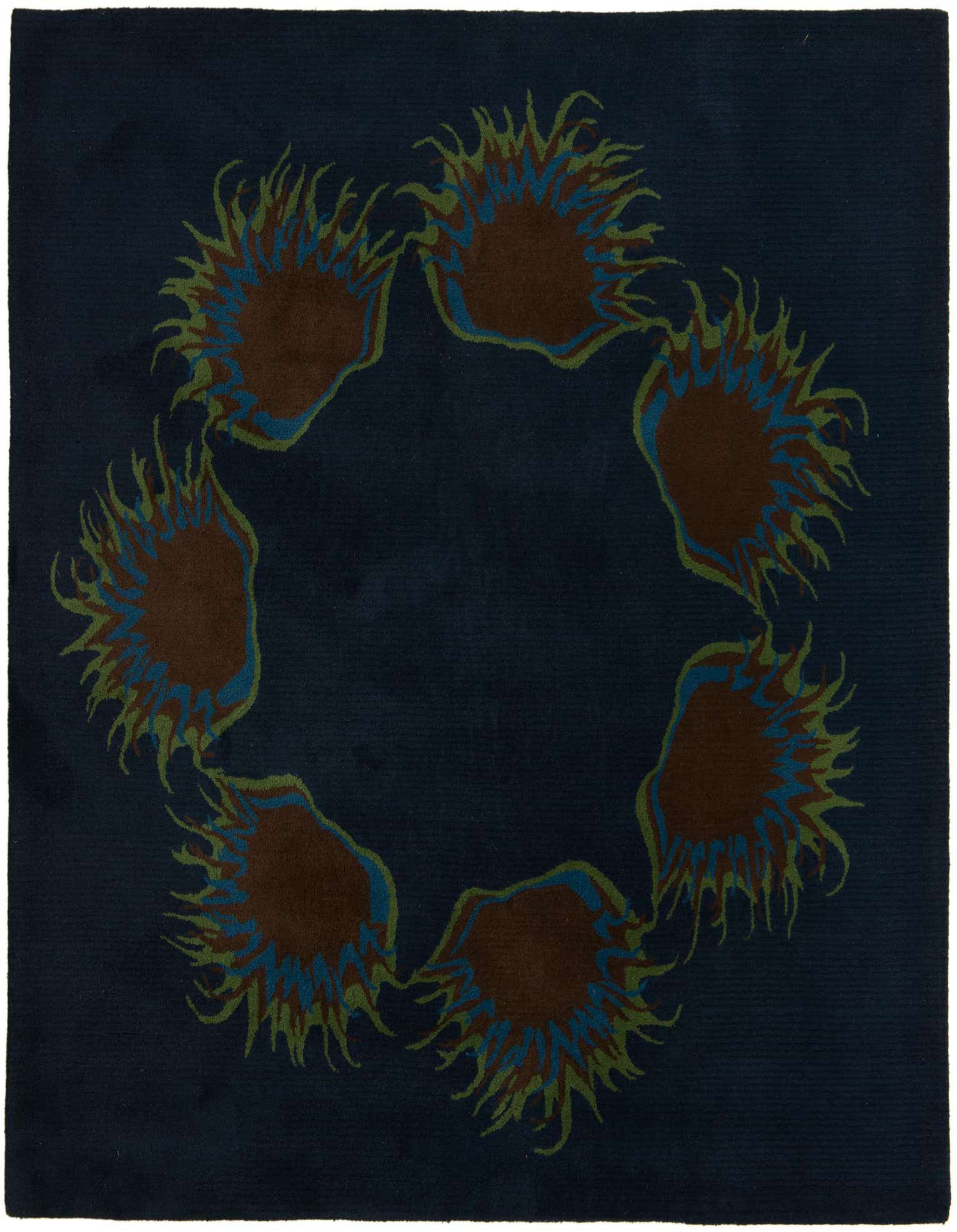 A square navy blue rug with a circular modern floral pattern featuring brown, green, and blue accents.