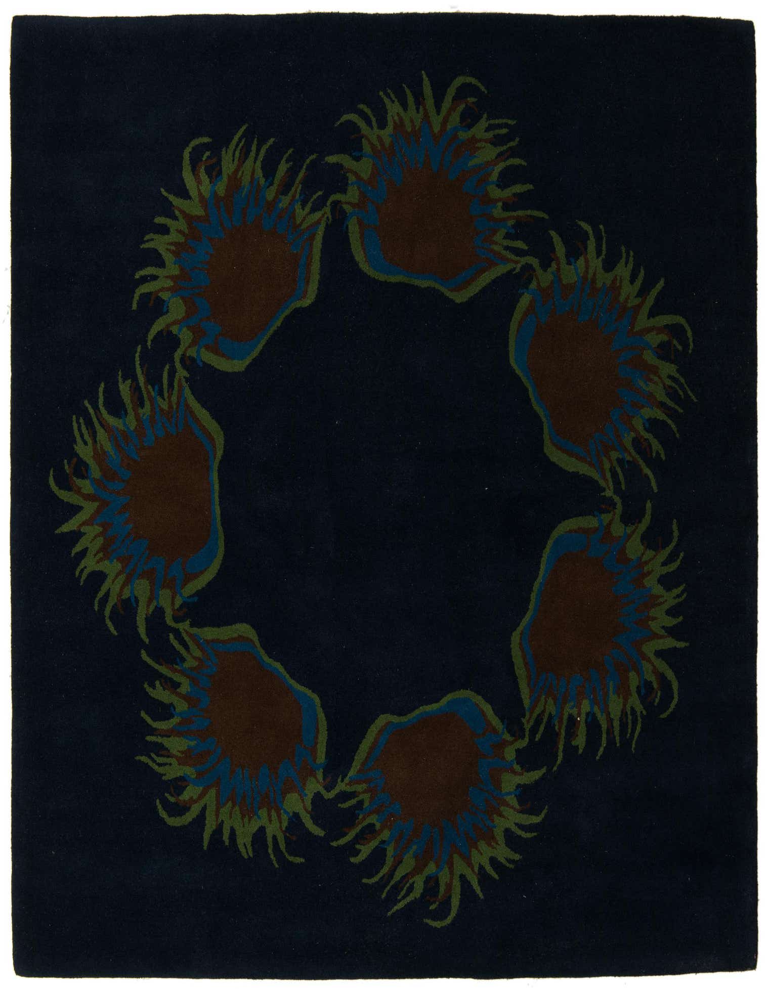 A square navy blue rug with a circular modern floral pattern featuring brown, blue, and green spiky shapes.