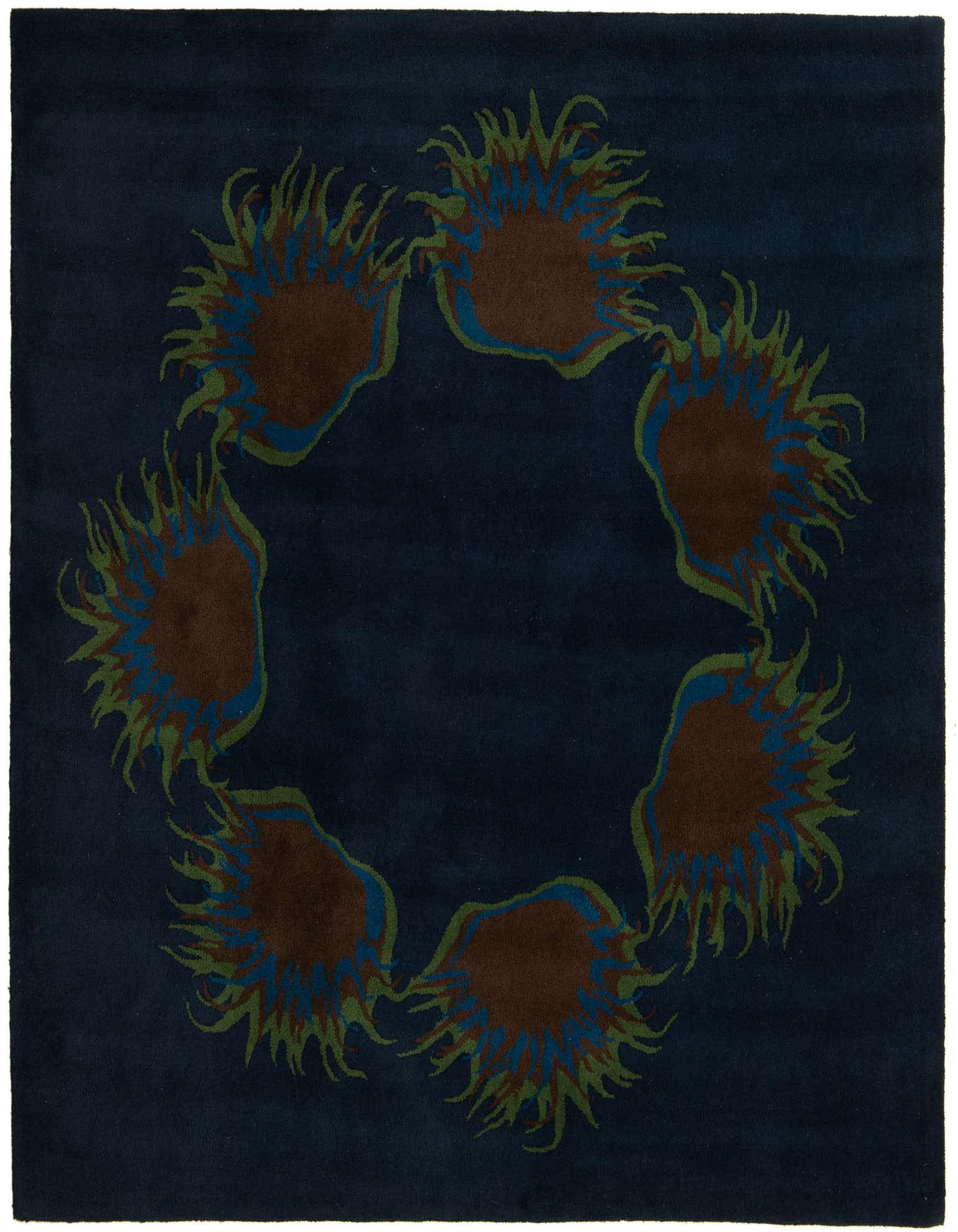 A square navy blue rug with a circular modern floral pattern featuring brown, green, and blue accents.