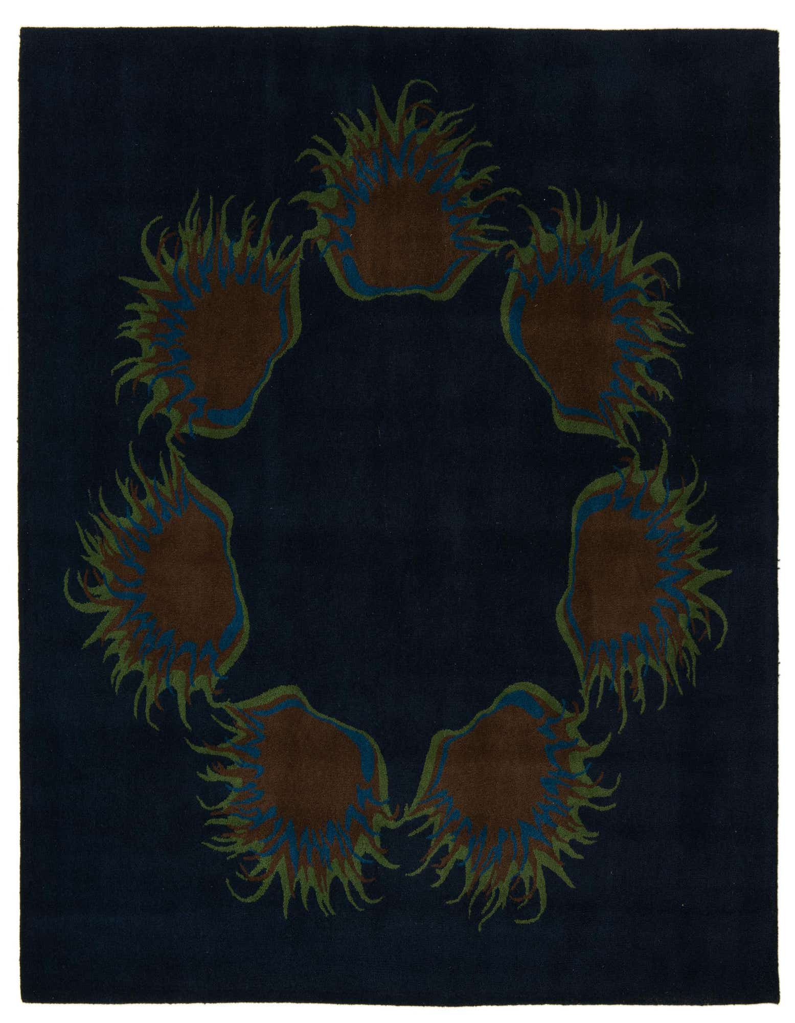 A square navy blue rug with a central circular floral pattern in brown, green, and blue, featuring a high pile.