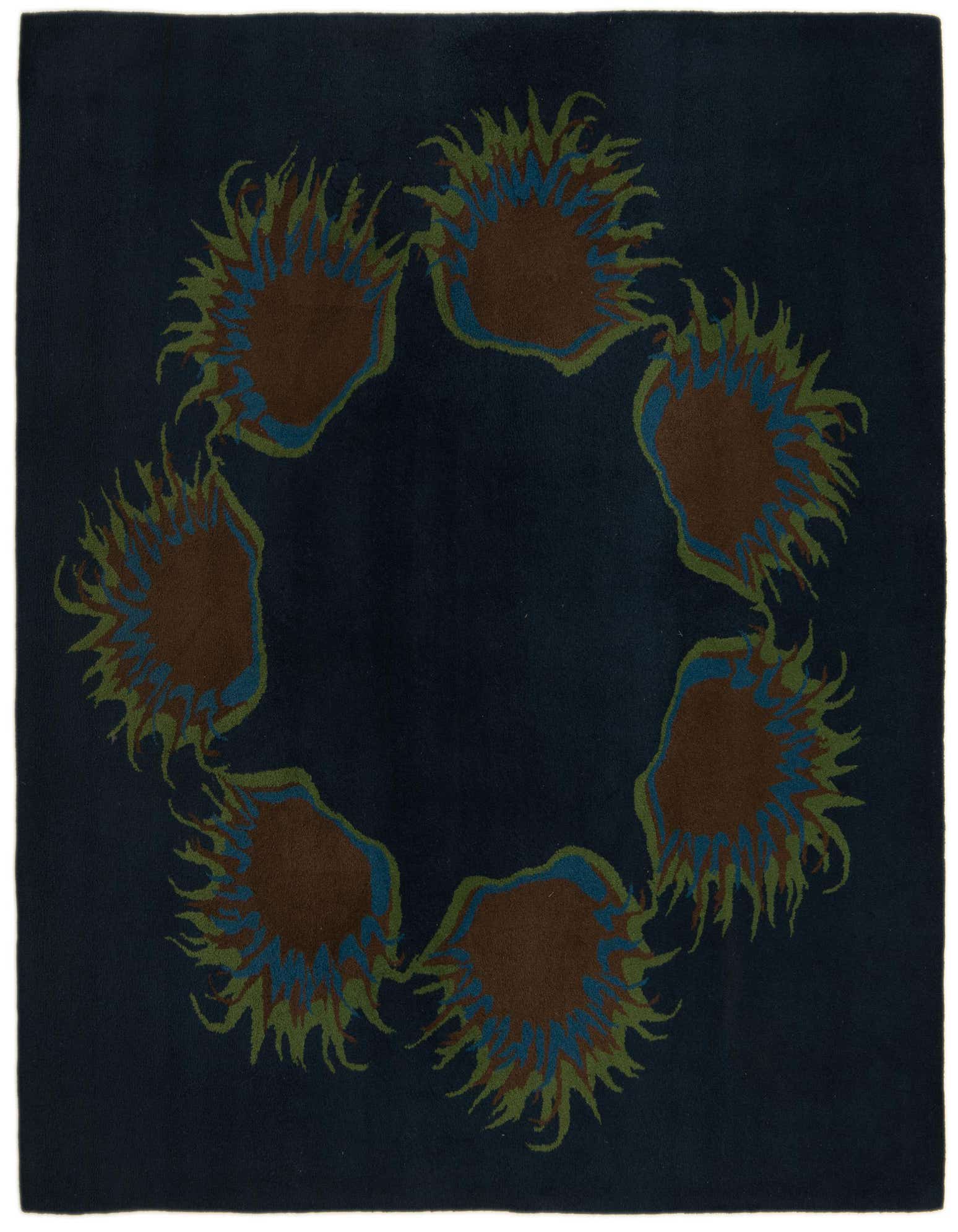 A square navy blue rug with a circular modern floral pattern in shades of brown, green, and light blue.