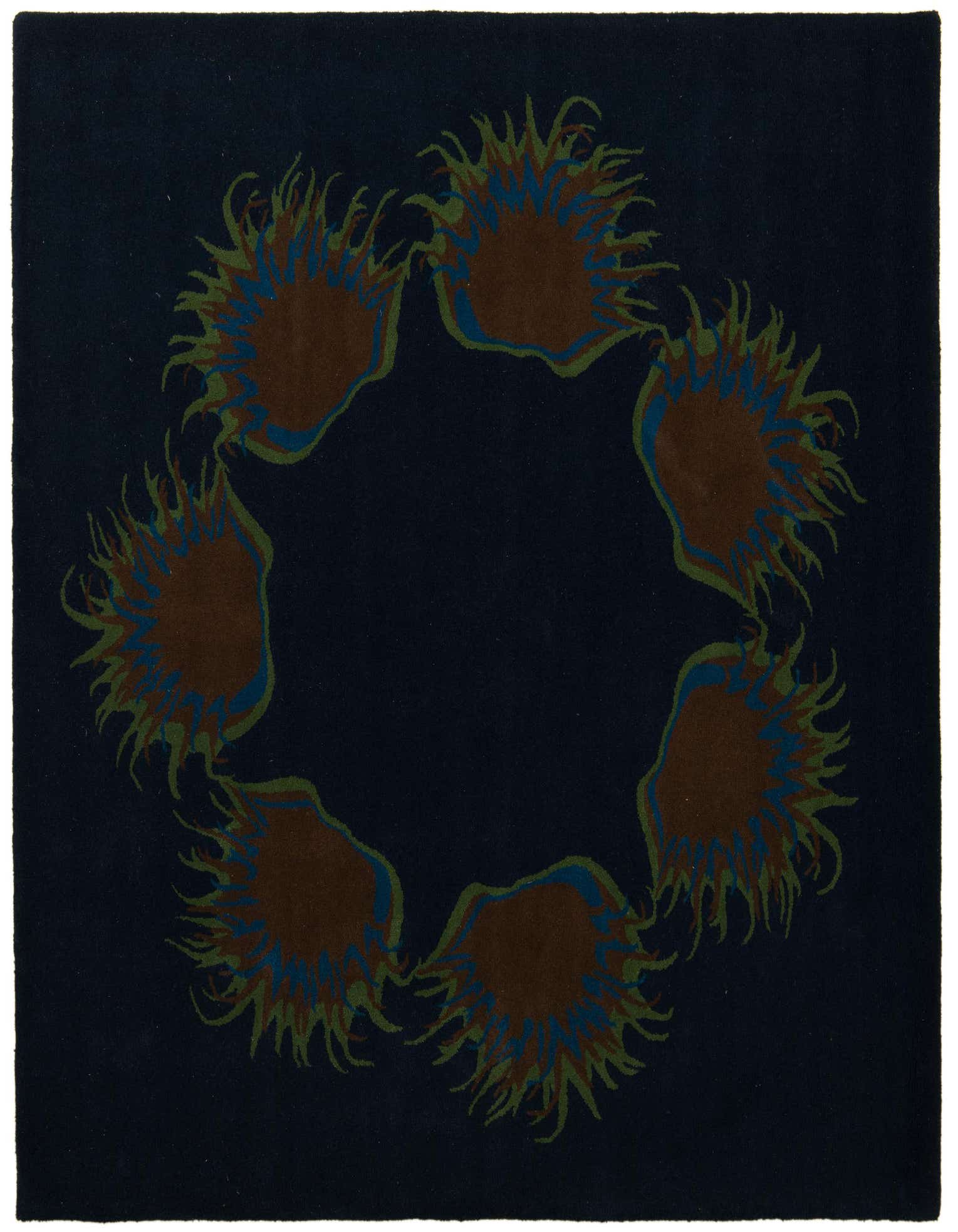 A square navy blue wool and cotton rug with a high pile, featuring a modern floral design of brown, green, and blue abstract shapes arranged in a circle.
