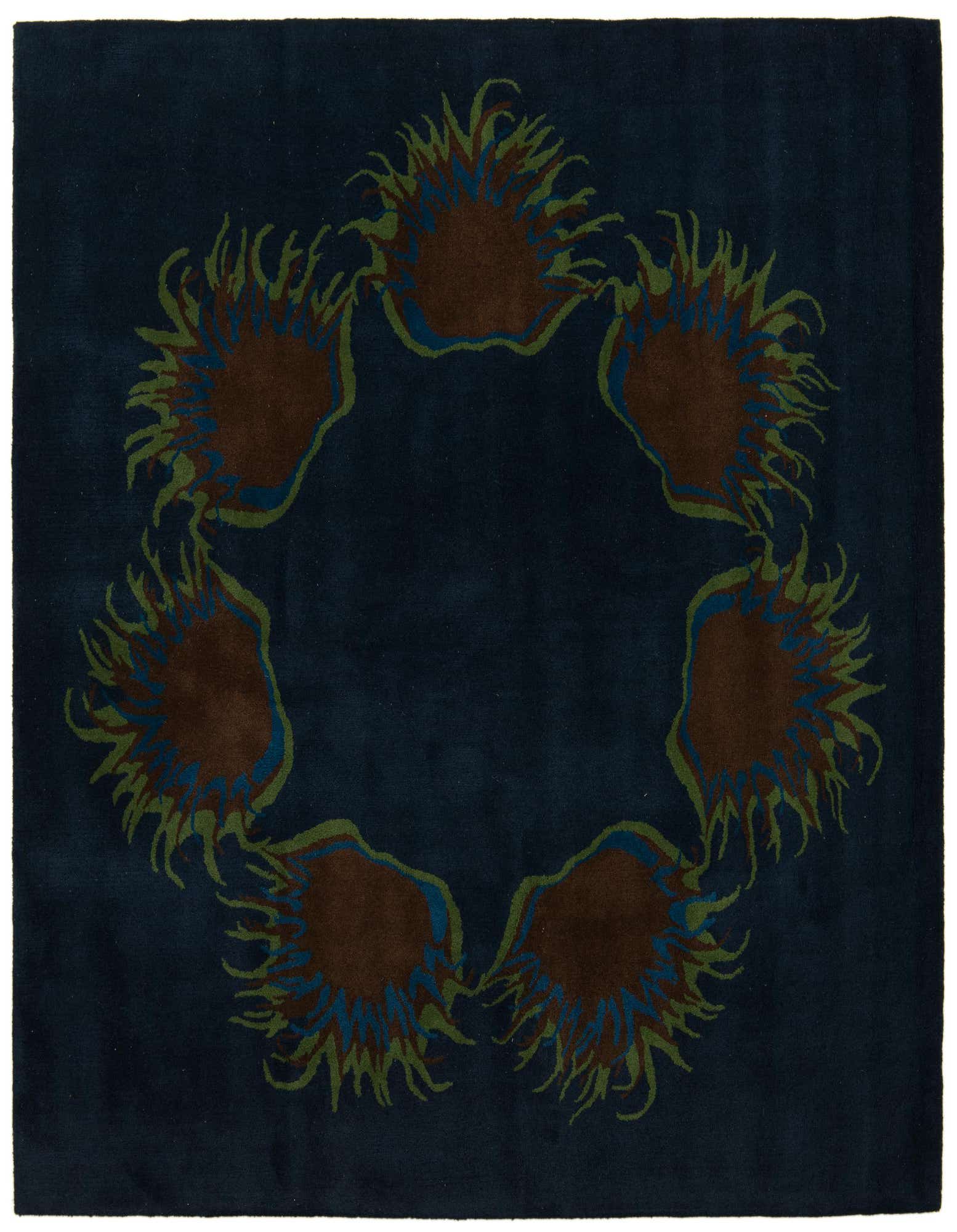 A square navy blue rug with a circular modern floral pattern in brown, green, and blue.