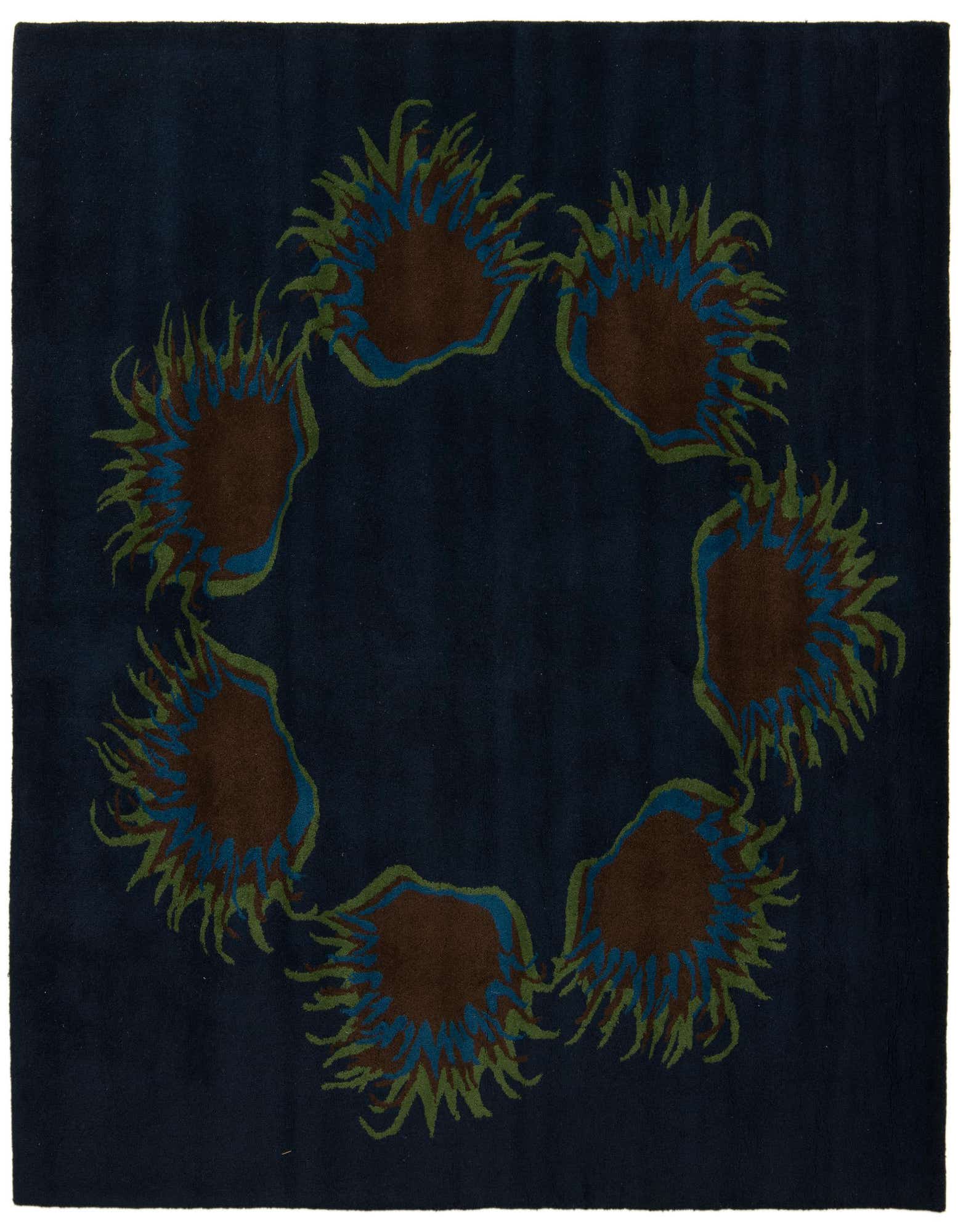 A 7' 6 x 7' 6 square navy blue modern rug with a circular floral pattern of brown, blue, and green.